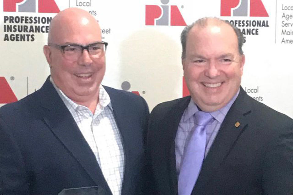 
L-R: PIANY past President and PIA National Director Richard A. Savino, CIC, CPIA, received the PIA National Agent of the Year award from his brother, Keith A. Savino, CPIA.